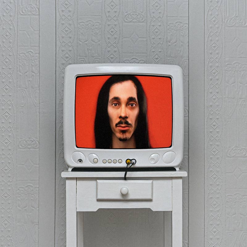 cover art: 3D render of lubalin over a red background on a tube TV atop a white dresser