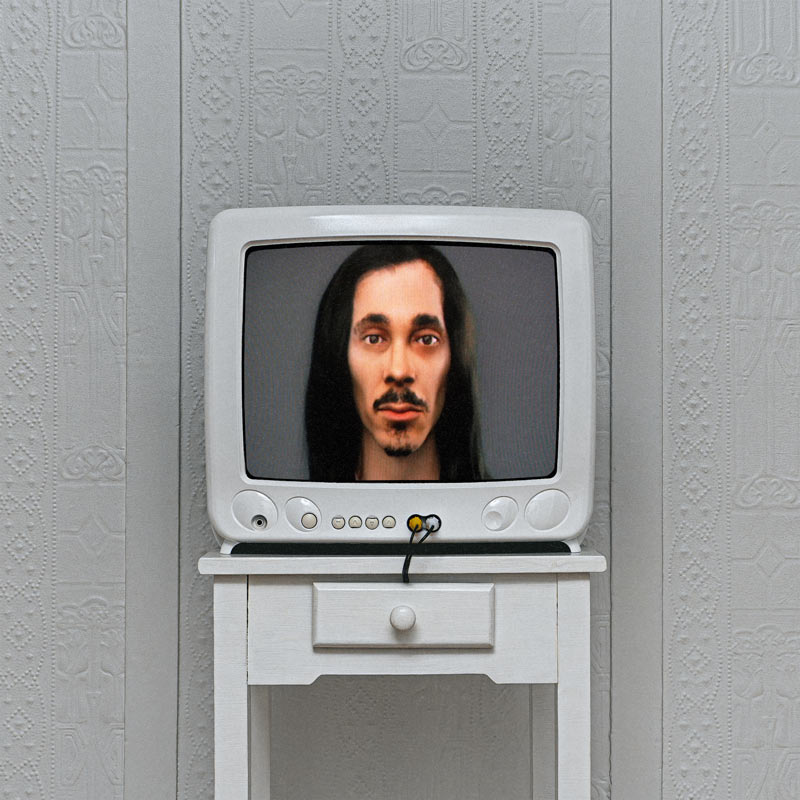 cover art: 3D render of lubalin over a grey background on a tube TV atop a white dresser